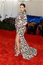 Kim Kardashian Dresses as Her Pregnant Met Gala Self for Halloween